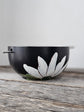 Black soup bowl with steel chopstick, white flower
