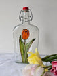 Recycled glass bottle with tulip design