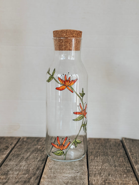 Carafe d'eau en verre design fleur abstraite