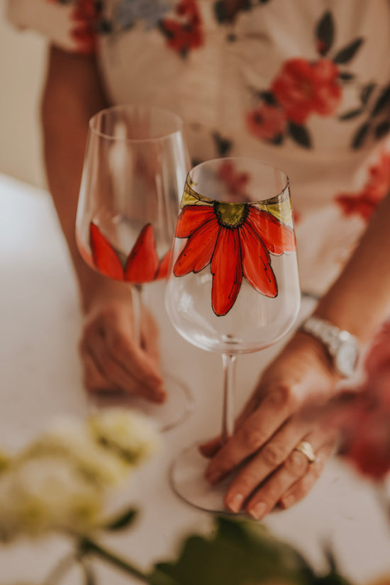 Duo of orange flower design wine glasses