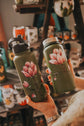 32 oz insulated green water bottle, hand-painted rudbeckia flower design.