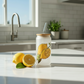 Frosted glass can with lid and straw lemon design