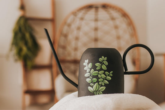 SMALL IMPERFAIT Black metal watering can with eucalyptus design
