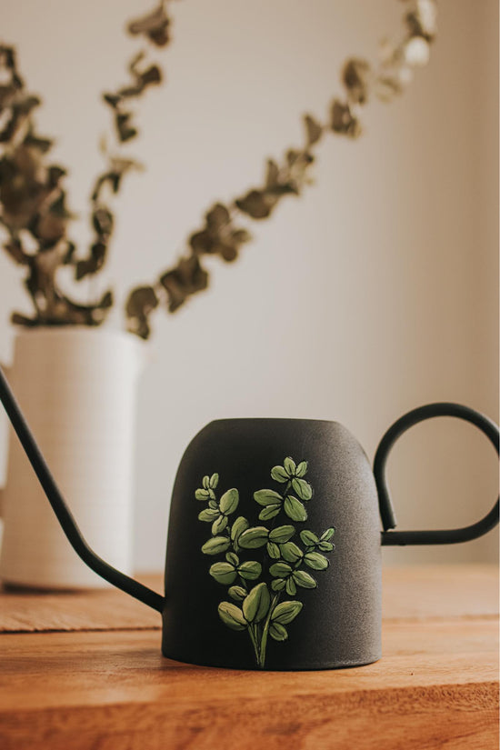 SMALL IMPERFAIT Black metal watering can with eucalyptus design