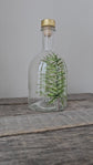 Recycled glass bottle with boreal design