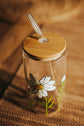 White cosmos design glass can with lid and straw