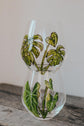 Carafe d'eau en verre design plante monstera