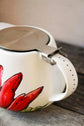 Théière avec infuseur design fleur rouge