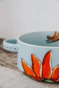 Gray blue bowl, 2 handles, hand painted orange half flower design