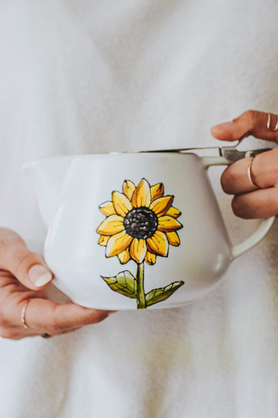 Teapot with sunflower design infuser