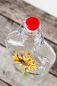 Recycled glass bottle for oil or salad dressing, sunflower design