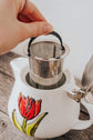 Teapot with red flower design infuser
