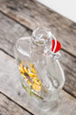 Recycled glass bottle for oil or salad dressing, sunflower design