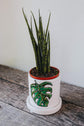 Small planter with saucer in porcelain design monstera plant