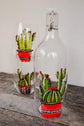 Water carafe and duo of stemless glasses design cactus flower