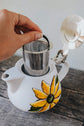 Teapot with red flower design infuser