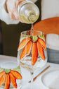 Duo of orange flower design wine glasses